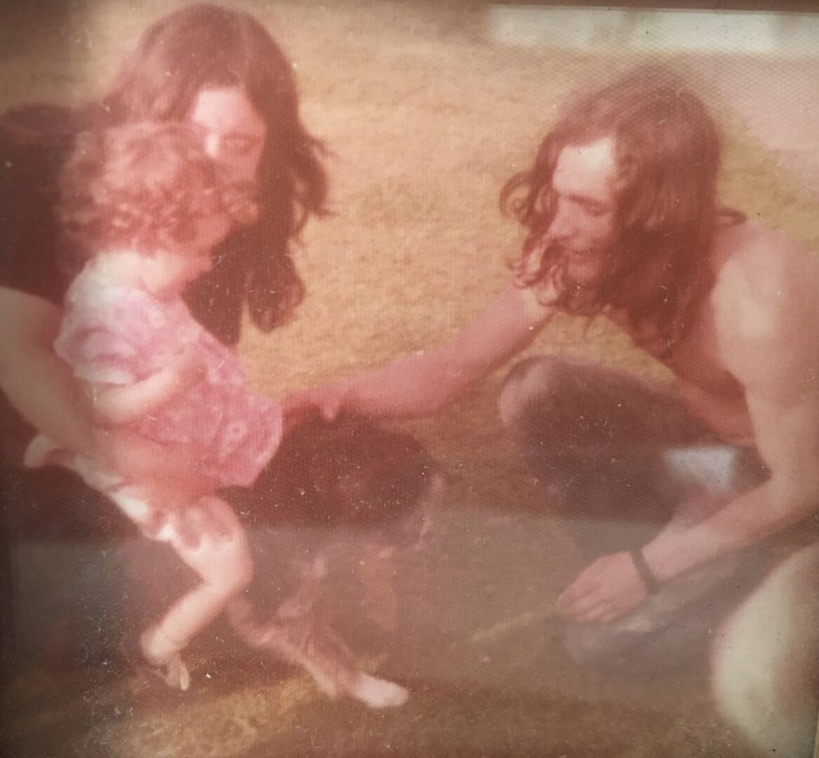 Me and my parents when I used to like sitting on Fido ;)